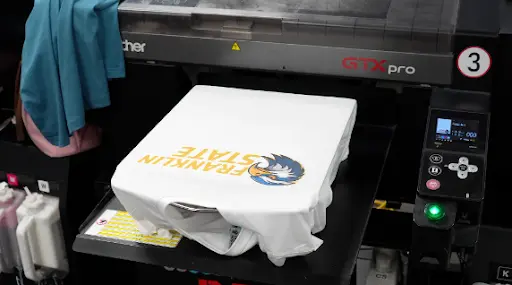 White shirt with direct to film eagle design being applied